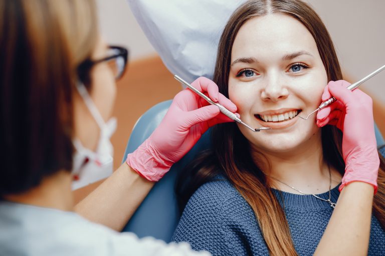 Beautiful girl sitting in the dentist's office