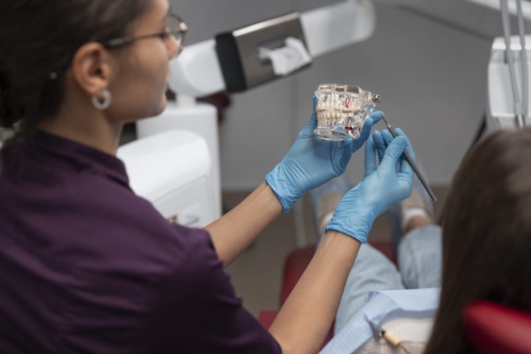 close-up-dentist-using-instruments