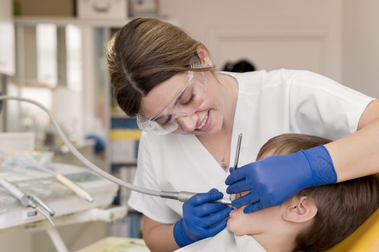 dentist-cleaning-child-s-teeth