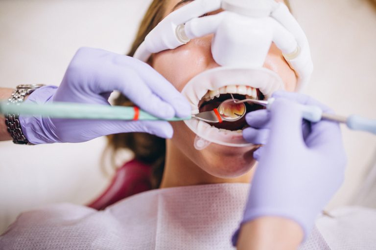 Dentist with patient at a visit